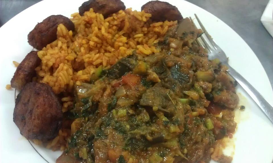 Eggplant stew cooked with collard greens, rice and fried plantains on the side. From Funmi's Cafe. I only eat like this when I go out.