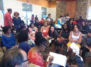 Writers of color gather at a publishing workshop.